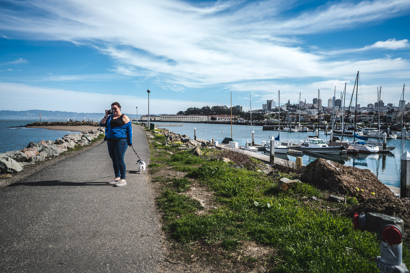 Lisa Winner walking near ocean with her dog in San Francisco