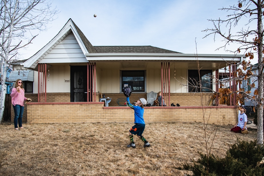 Kids playing outside in front yard in Denver, CO
