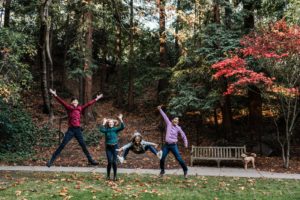 Family poses during holiday photo session in Oakland, CA