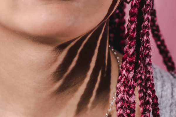 Details of pink braids during teen photography session in Alameda, CA